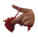 A hand weaving red yarn